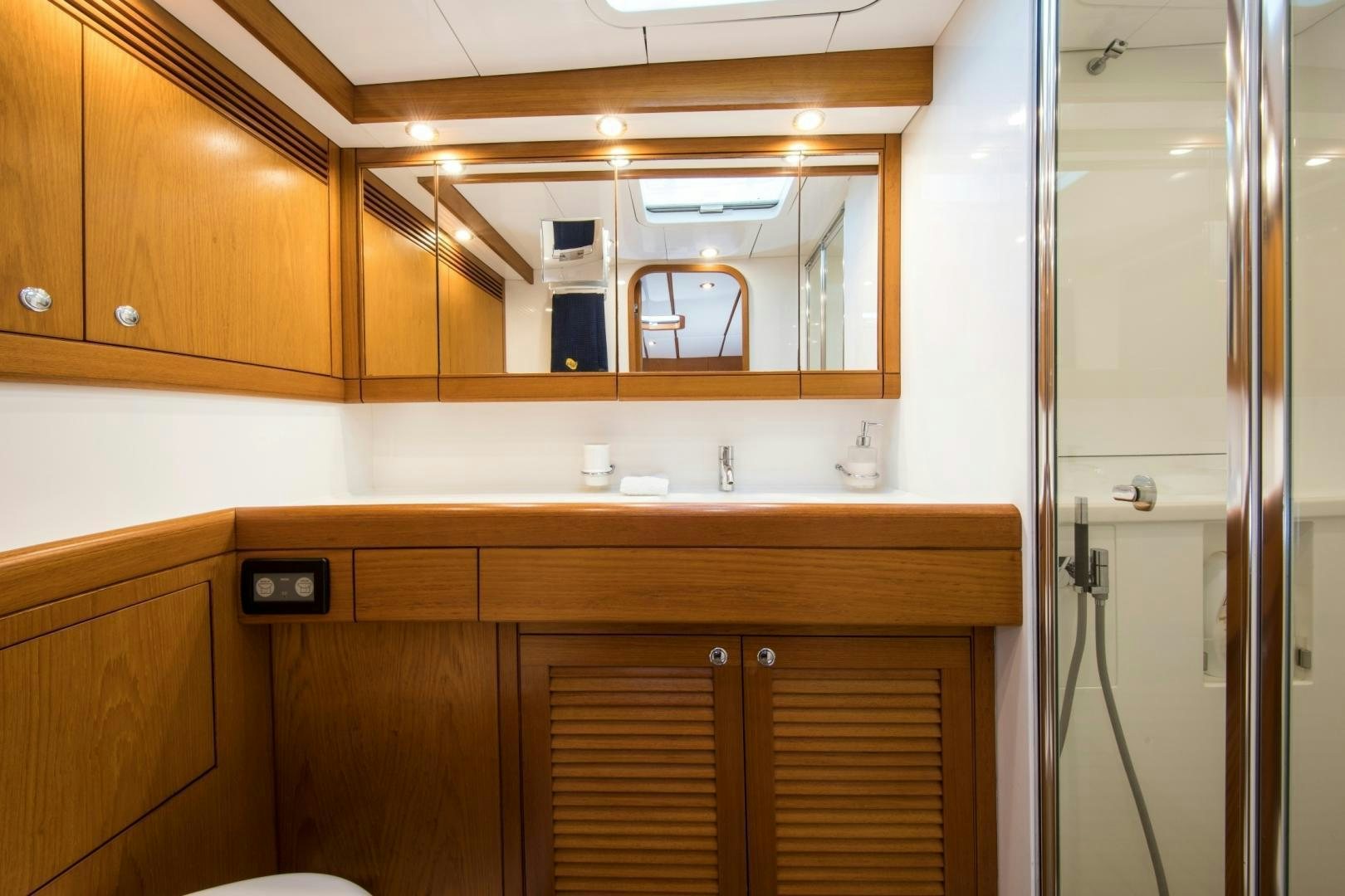 a bathroom with a sink and a shower unit aboard MEDUSA Yacht for Sale