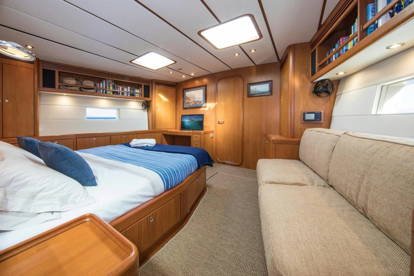 a bedroom with a bed and a couch aboard MEDUSA Yacht for Sale