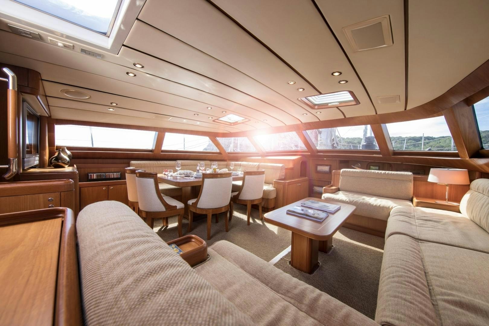 a train with a table and chairs aboard MEDUSA Yacht for Sale