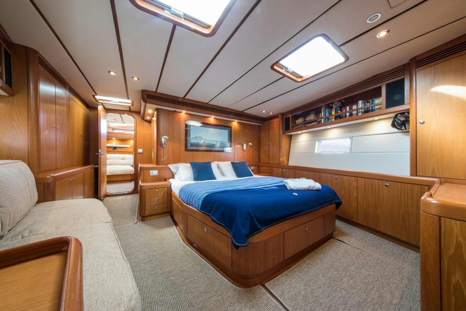 a bedroom with a bed and a couch aboard MEDUSA Yacht for Sale