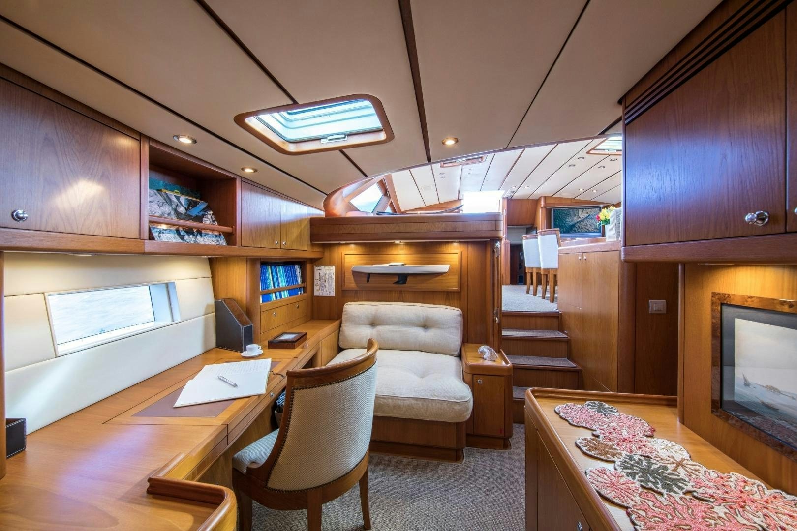a living room with a staircase aboard MEDUSA Yacht for Sale