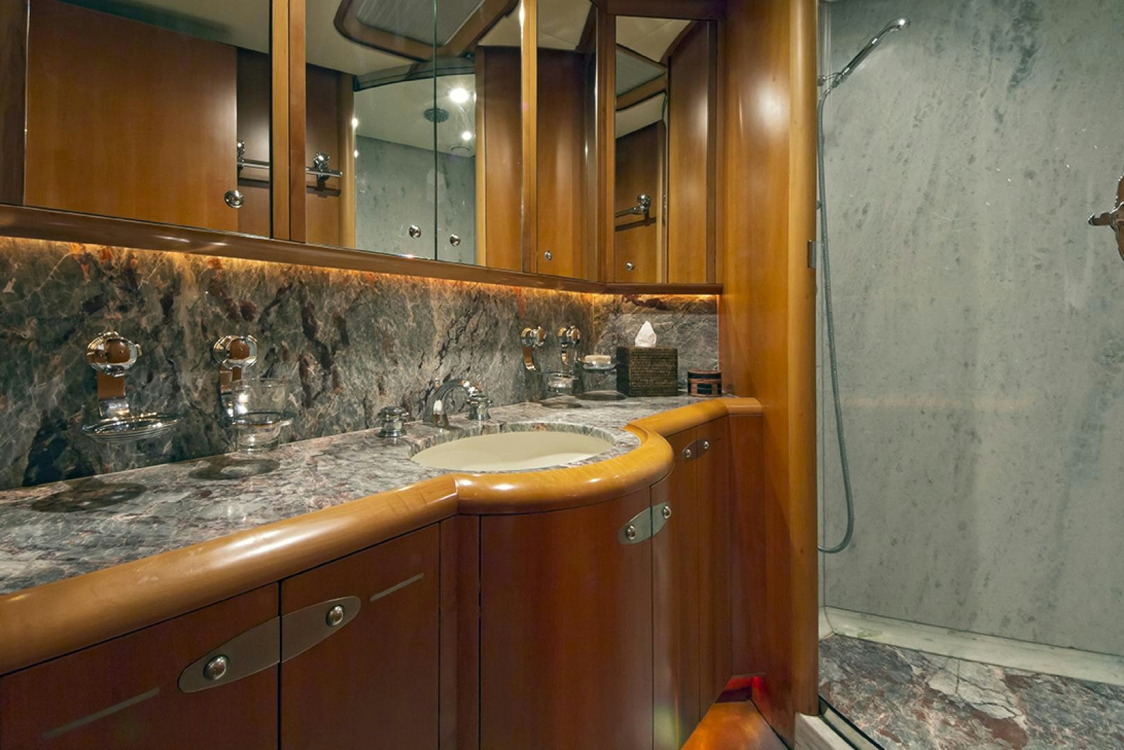 a bathroom with a countertop sink and a mirror aboard HAVANA OF LONDON Yacht for Sale