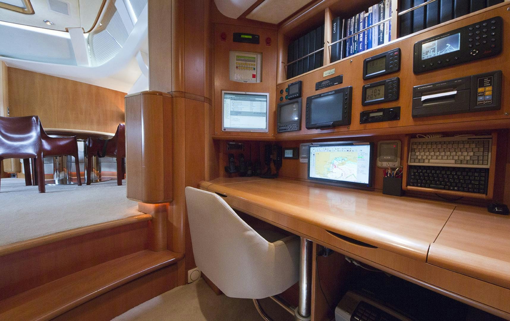 a room with computers and chairs aboard HAVANA OF LONDON Yacht for Sale