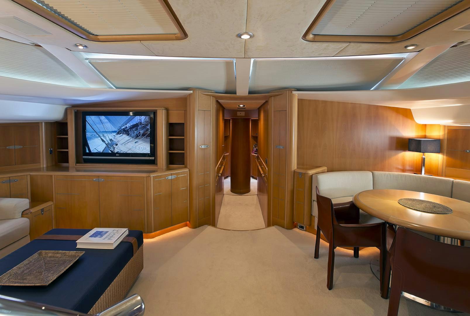 a room with a tv and desk aboard HAVANA OF LONDON Yacht for Sale