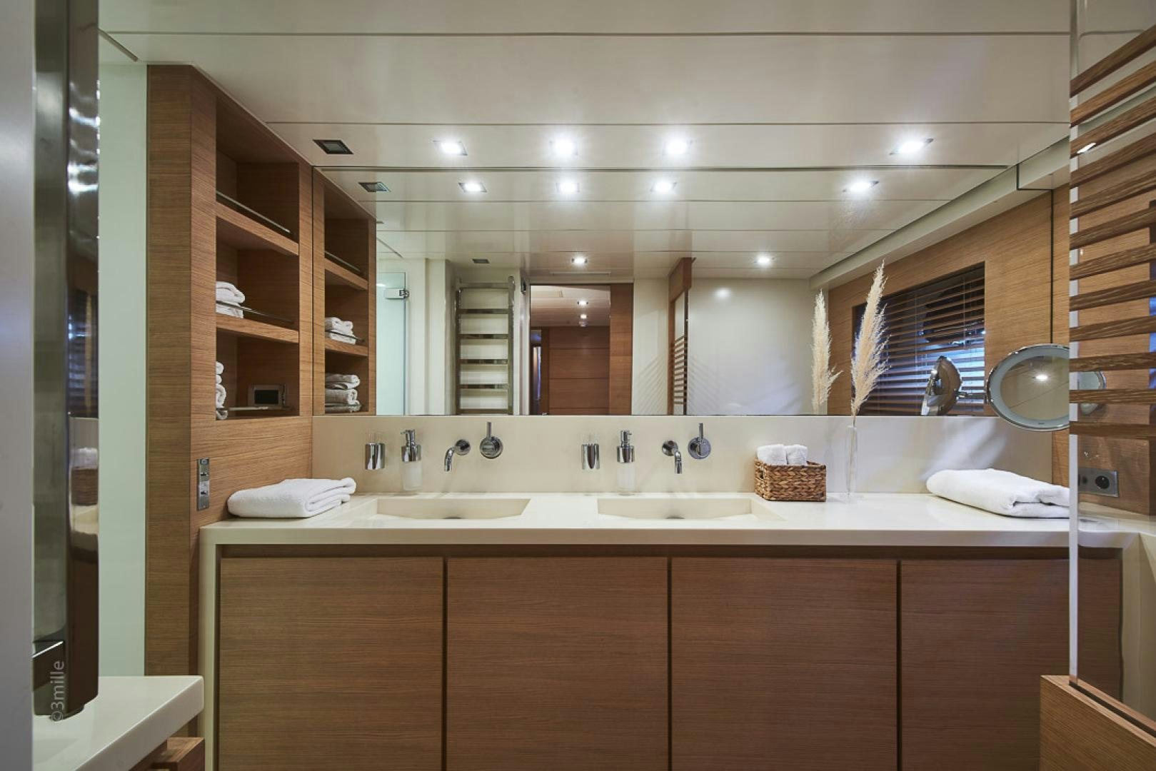 a bathroom with a large mirror aboard HUMMINGBIRD Yacht for Sale