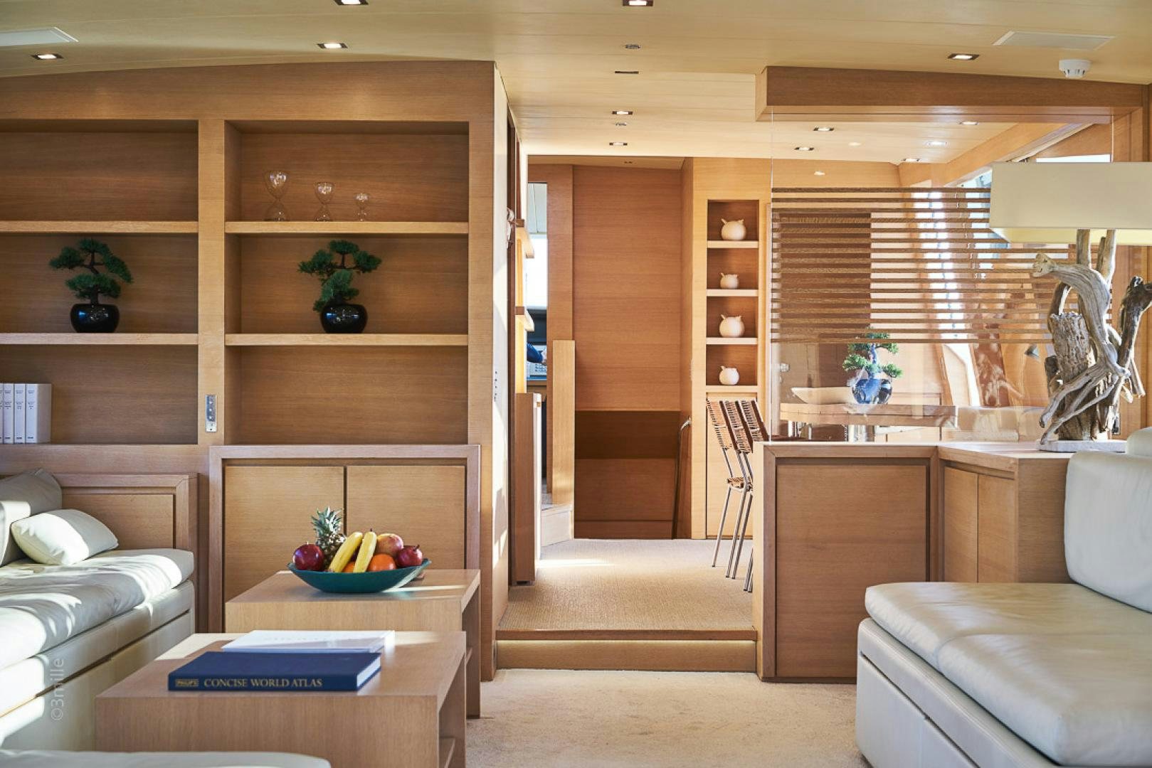 a room with wooden cabinets and a bed and a table aboard HUMMINGBIRD Yacht for Sale