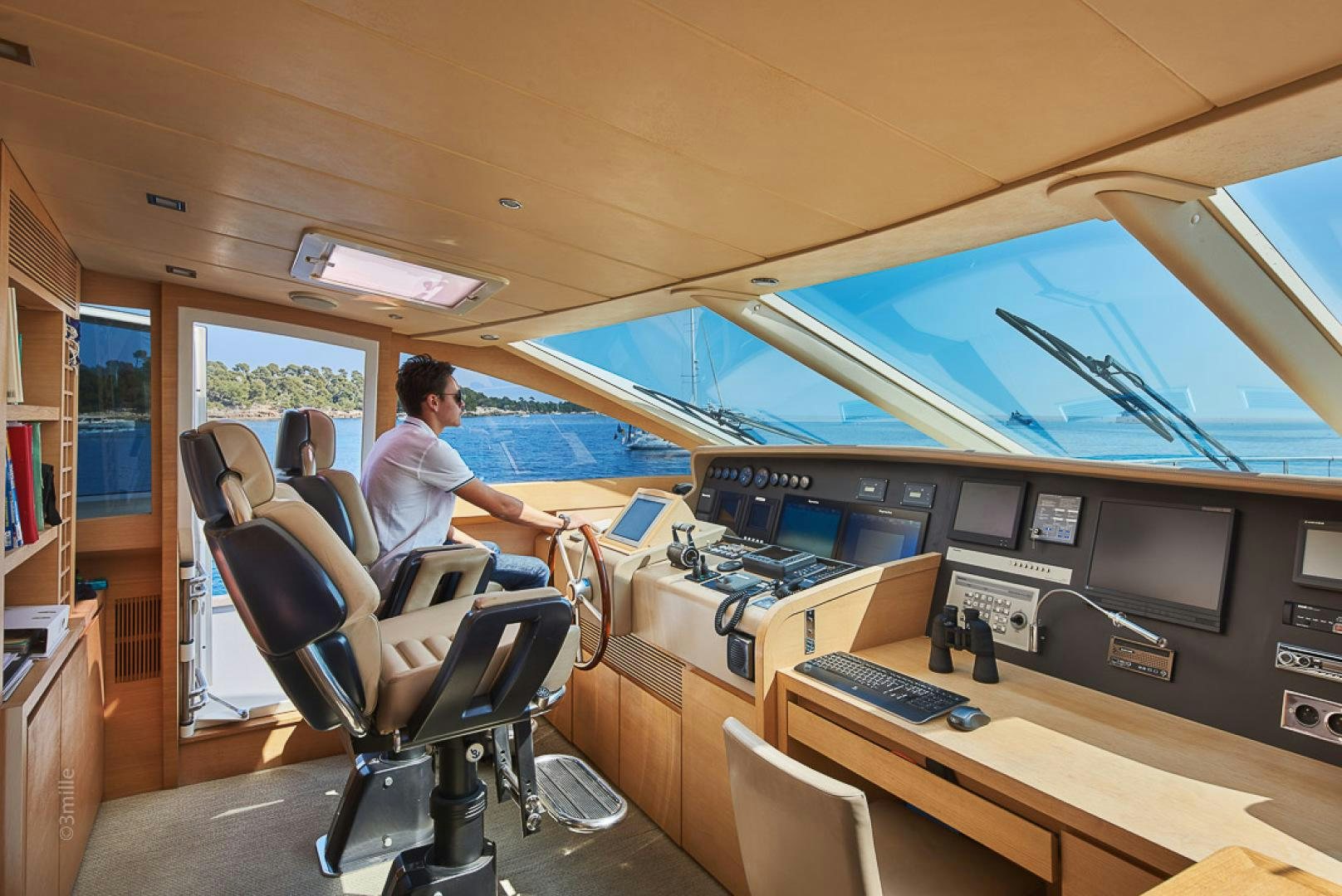 a man and woman sitting in a boat on a boat aboard HUMMINGBIRD Yacht for Sale