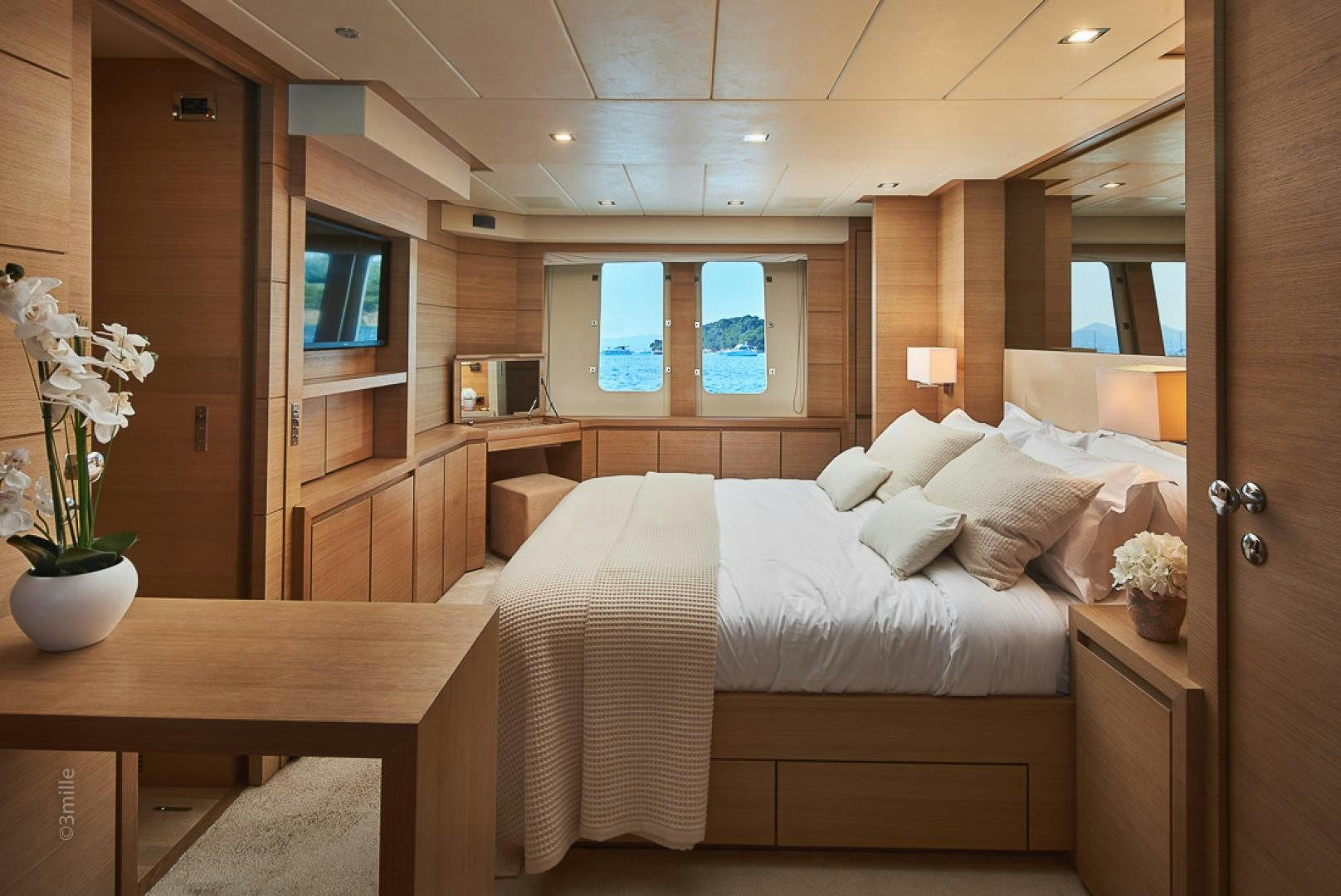 a bed in a room aboard HUMMINGBIRD Yacht for Sale