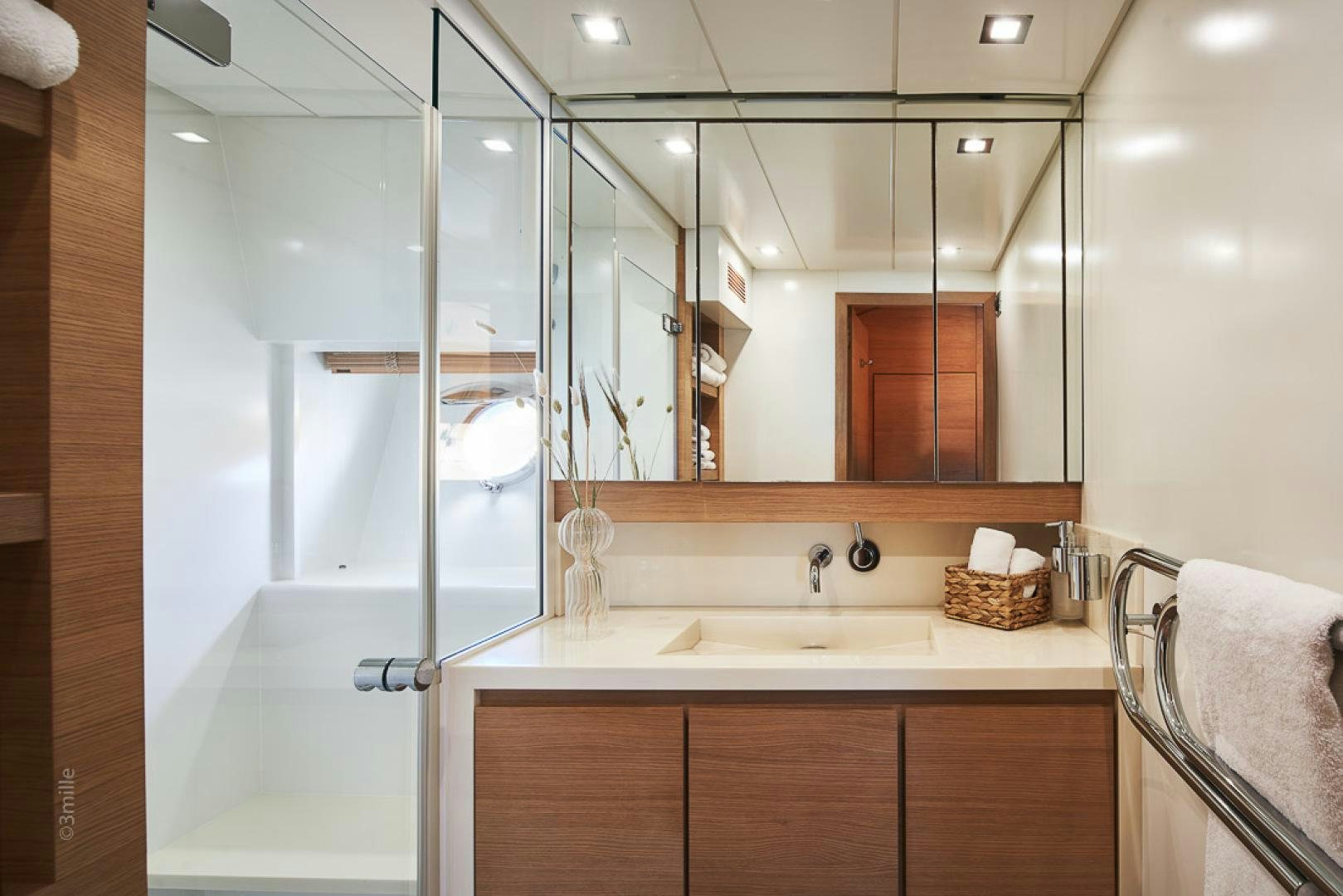 a bathroom with a glass shower aboard HUMMINGBIRD Yacht for Sale