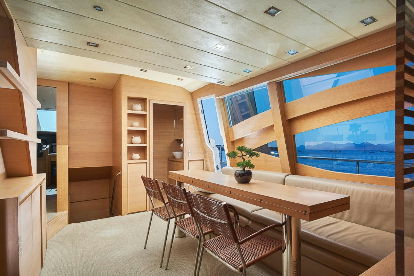 a room with a table and chairs aboard HUMMINGBIRD Yacht for Sale
