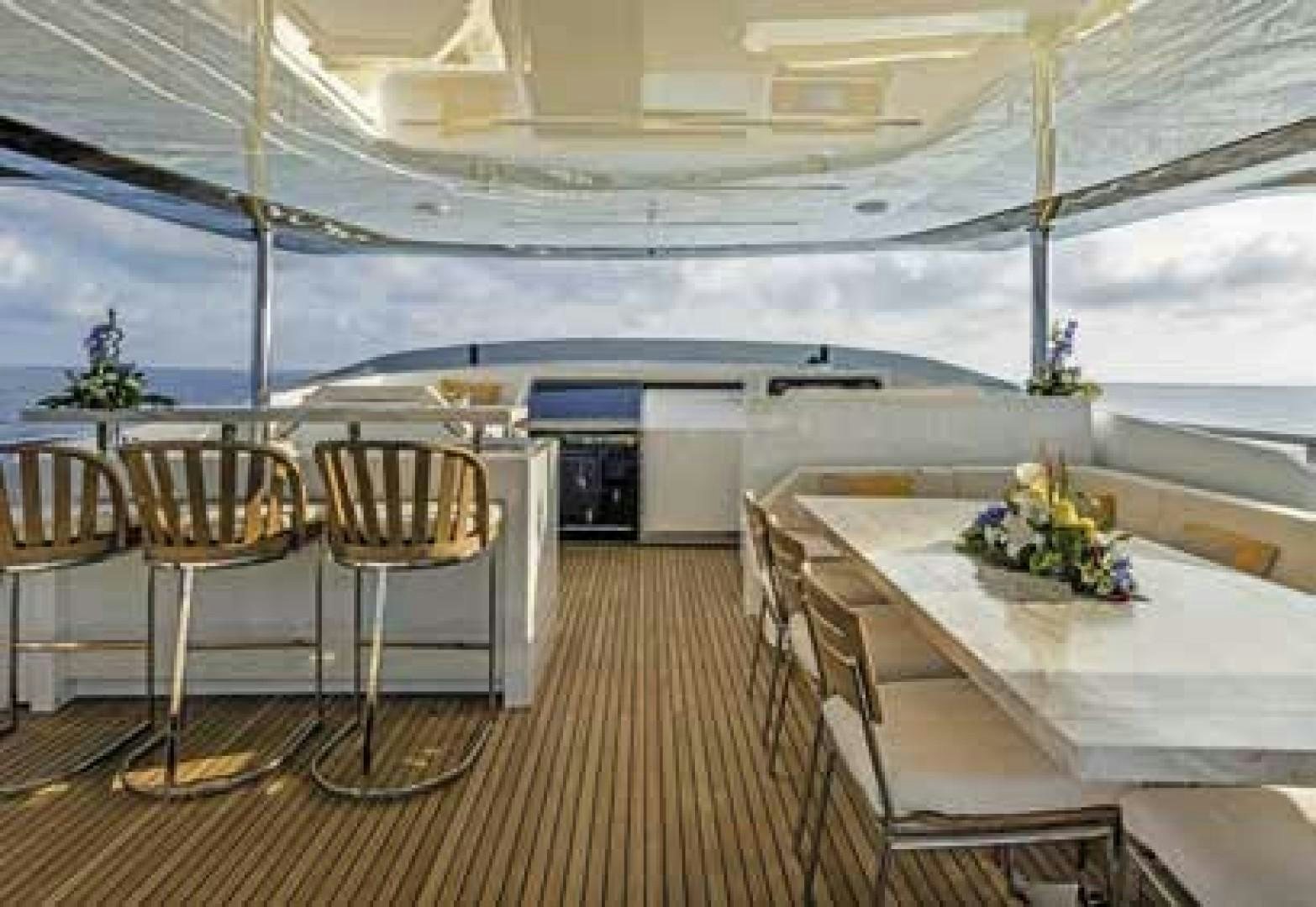 a room with a table and chairs aboard No Name Yacht for Sale