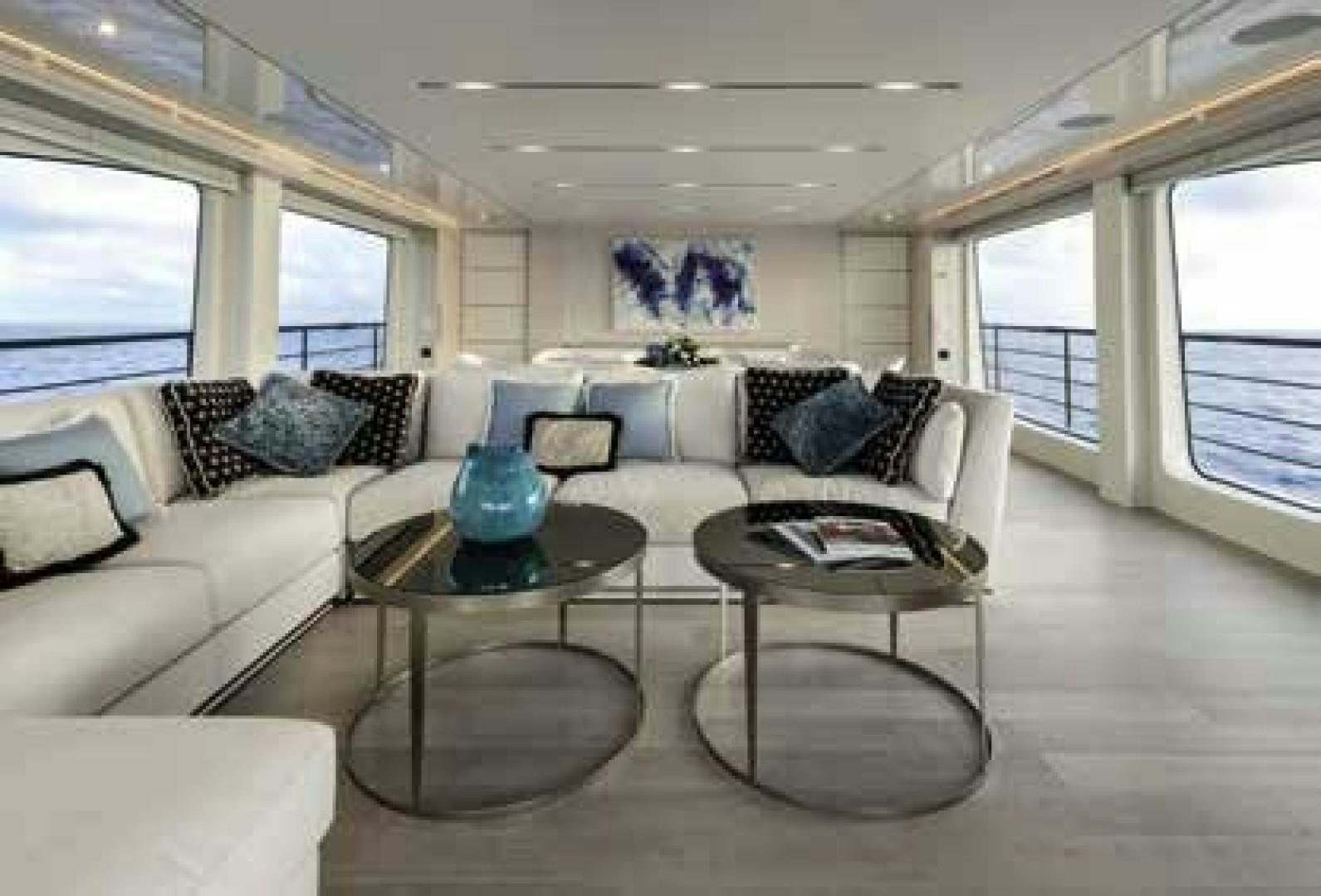 a living room with a couch and coffee table aboard No Name Yacht for Sale