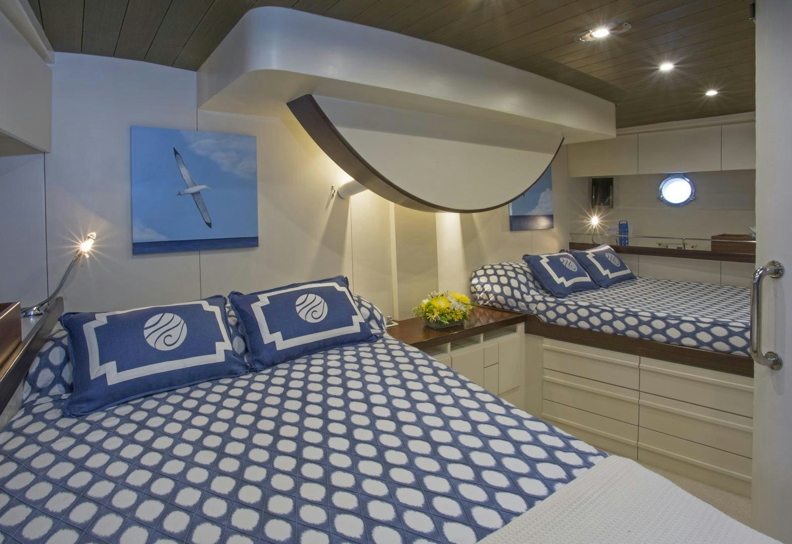 a room with a bed and a desk aboard JUPITER Yacht for Sale