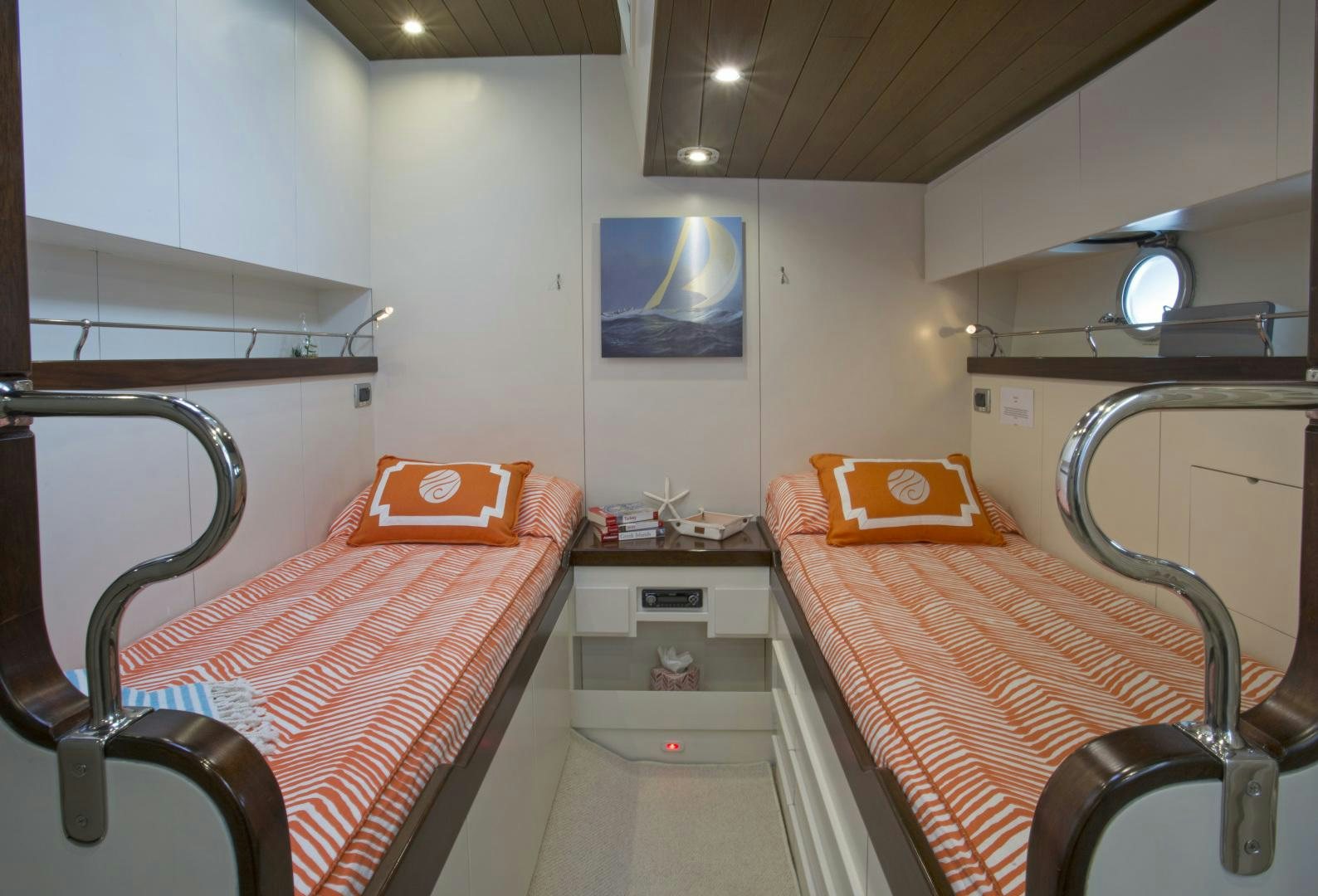 a room with a bed and a chair aboard JUPITER Yacht for Sale