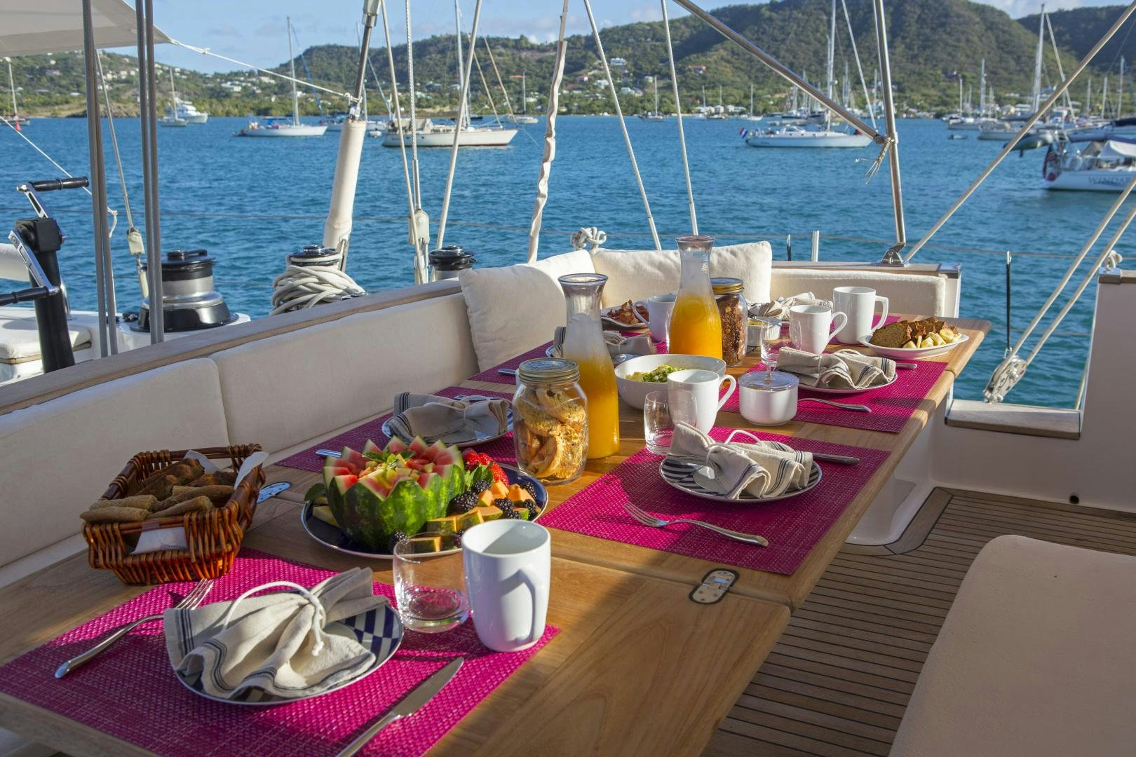 a table with food and drinks on it aboard JUPITER Yacht for Sale