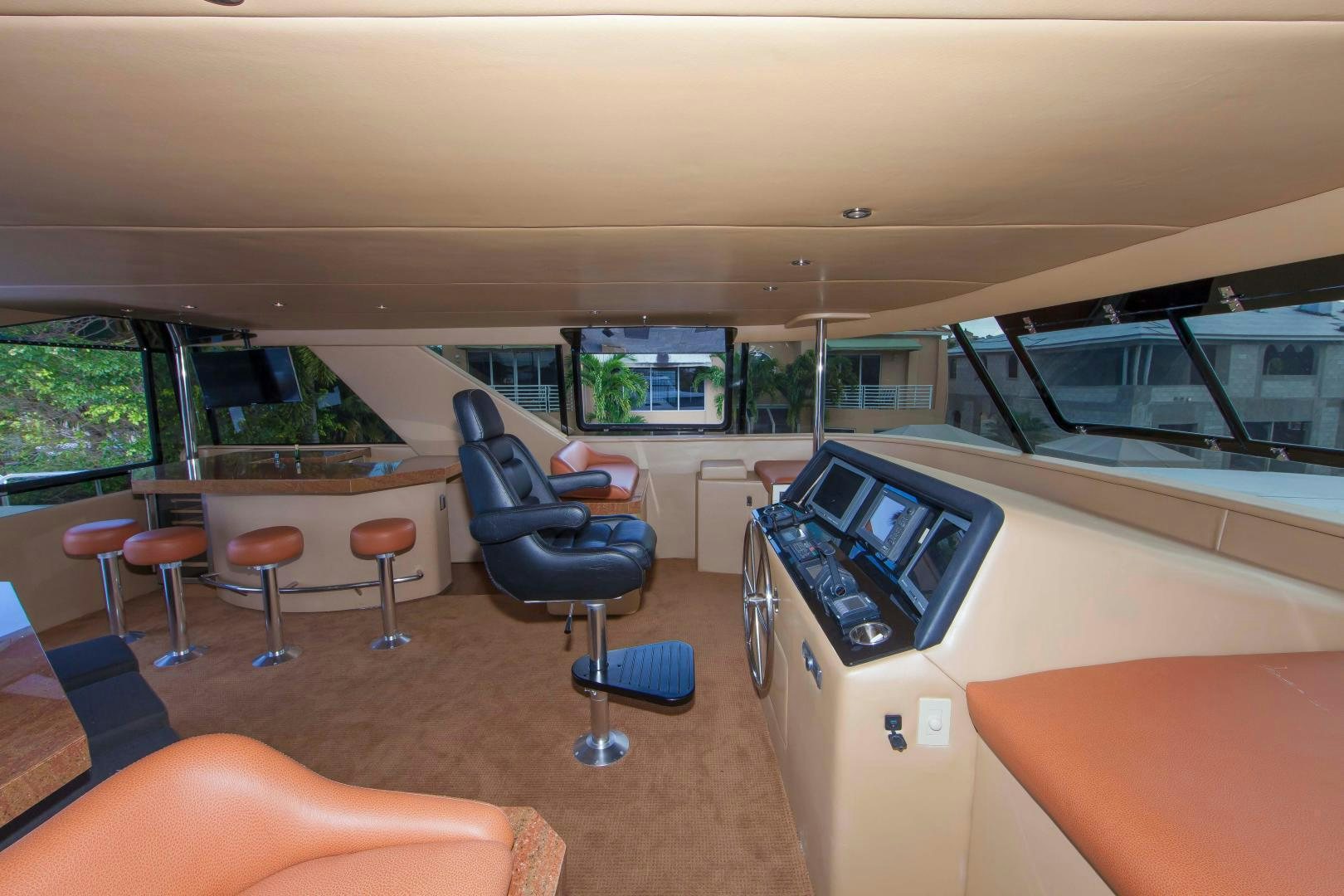 inside of a vehicle with a table and chairs and a large window aboard MONARCH Yacht for Sale