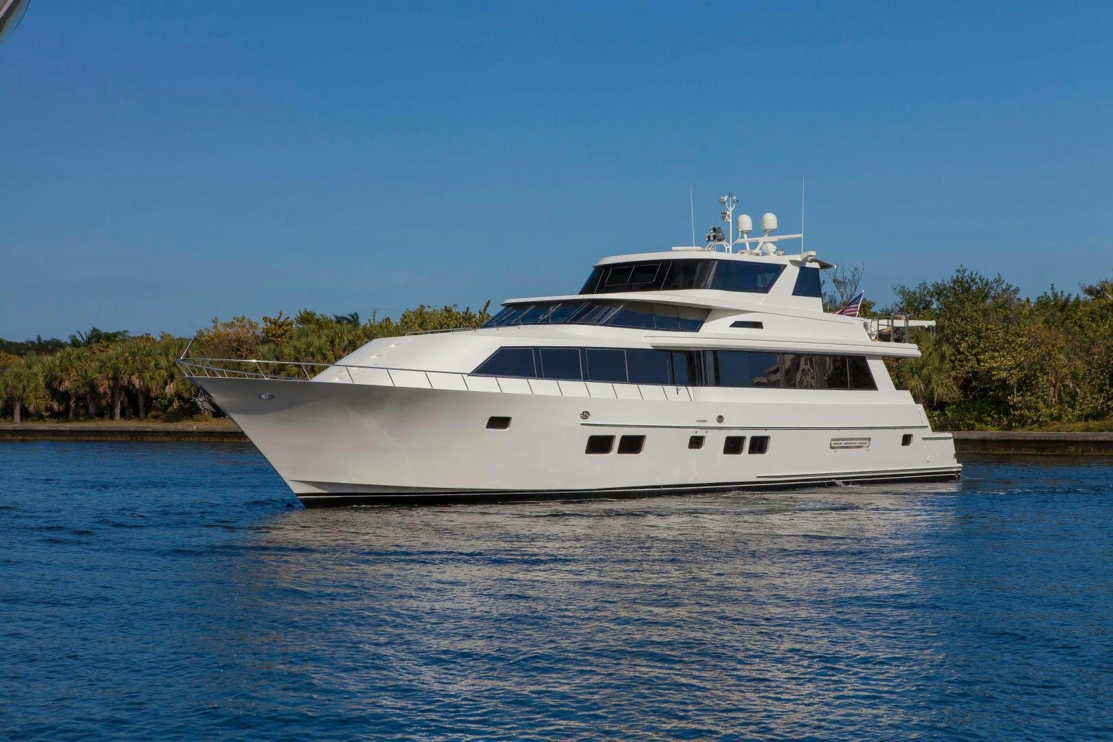 a white yacht on the water aboard MONARCH Yacht for Sale