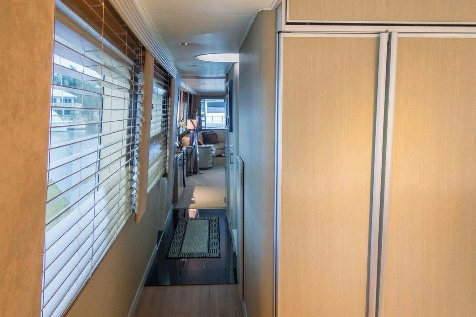 a hallway with a glass door aboard MONARCH Yacht for Sale