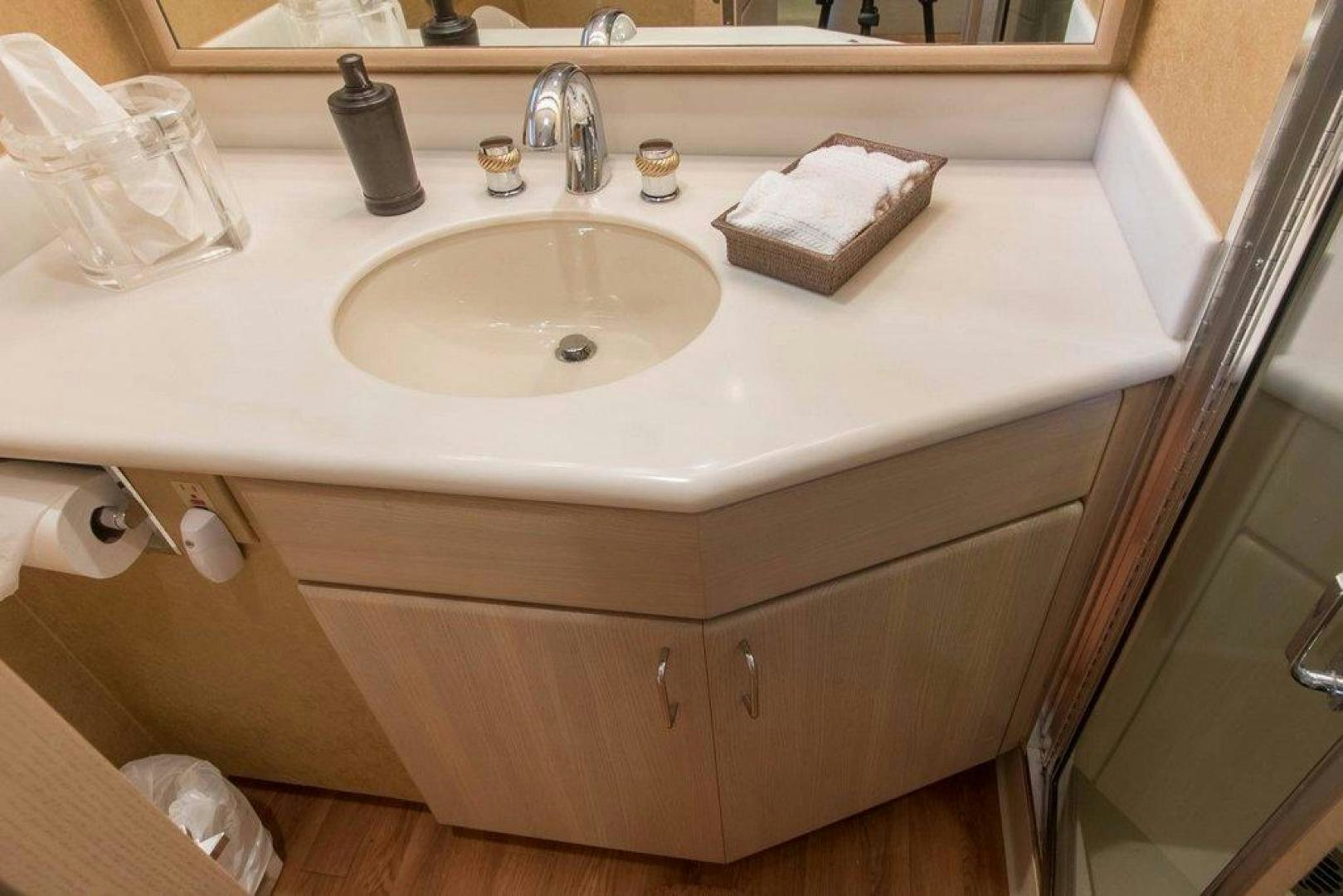 a bathroom sink with toilet paper aboard MONARCH Yacht for Sale