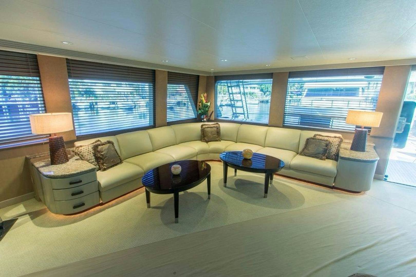 a living room with a couch and a coffee table aboard MONARCH Yacht for Sale