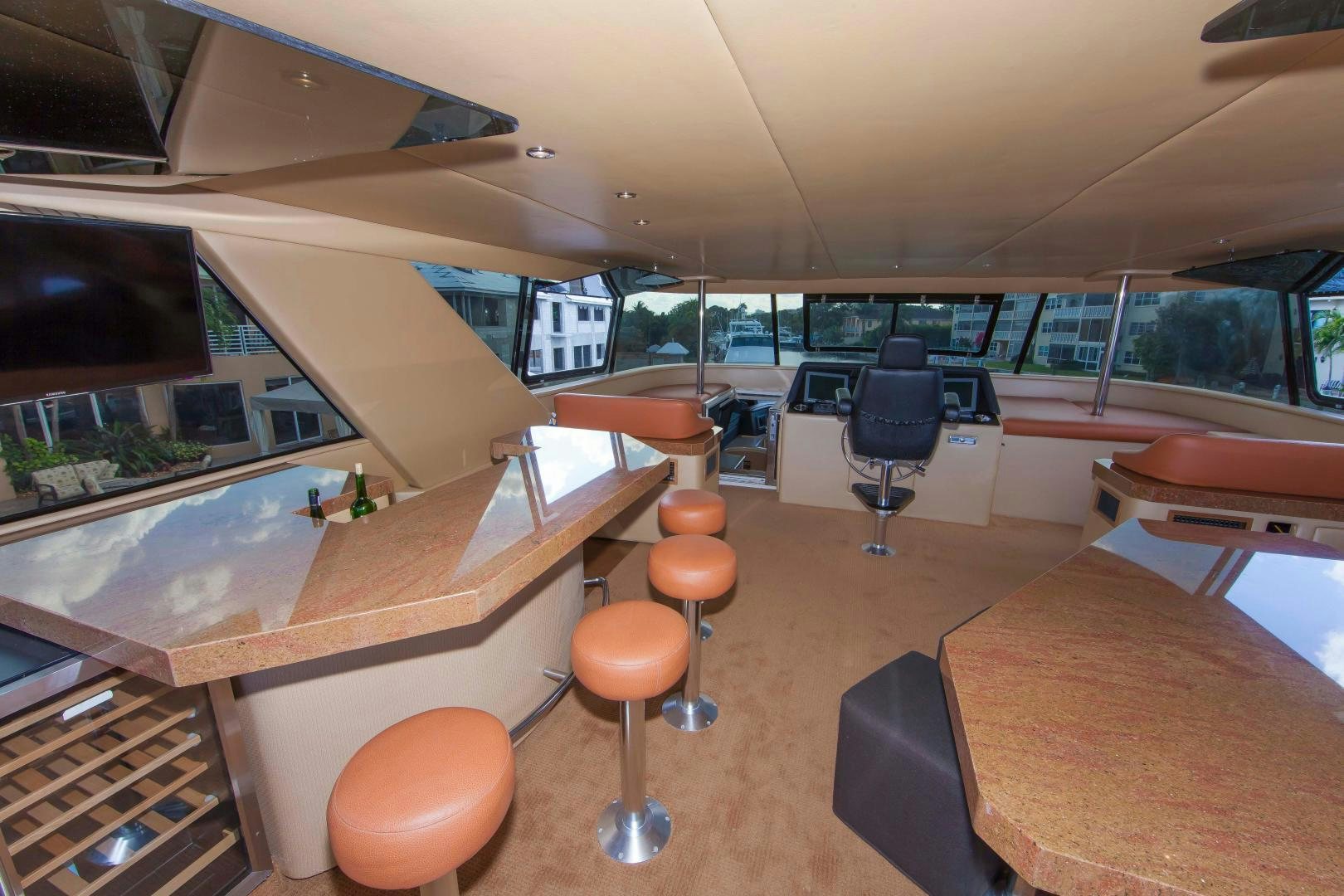 a room with a table and chairs aboard MONARCH Yacht for Sale