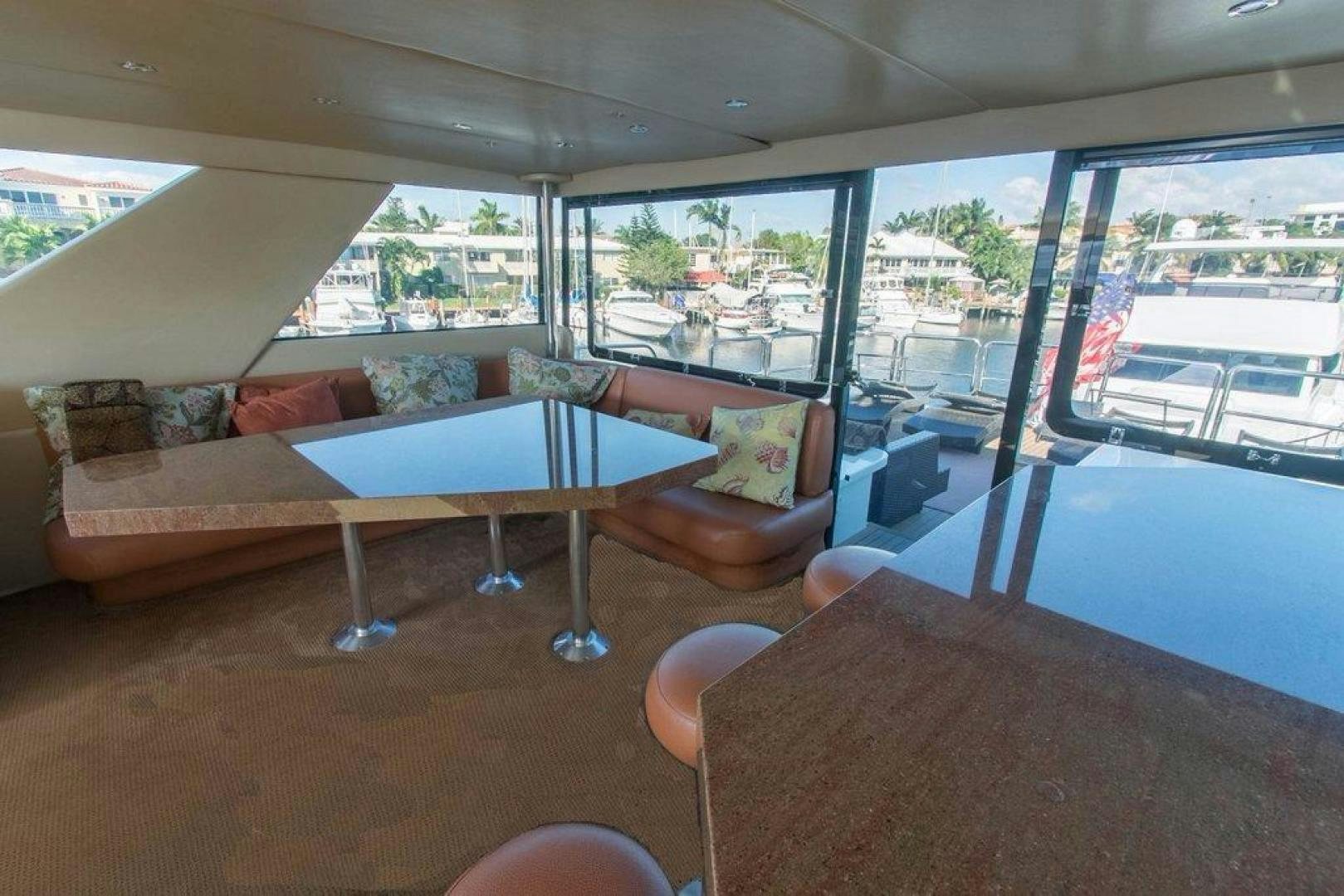 a living room with a couch and a table aboard MONARCH Yacht for Sale