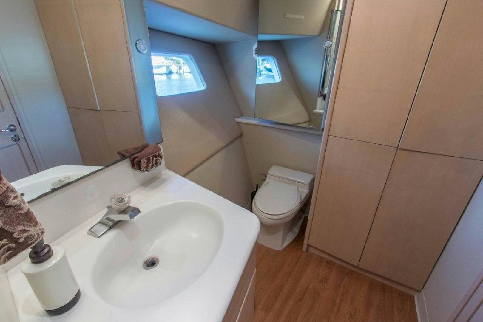 a bathroom with a sink and toilet aboard MONARCH Yacht for Sale