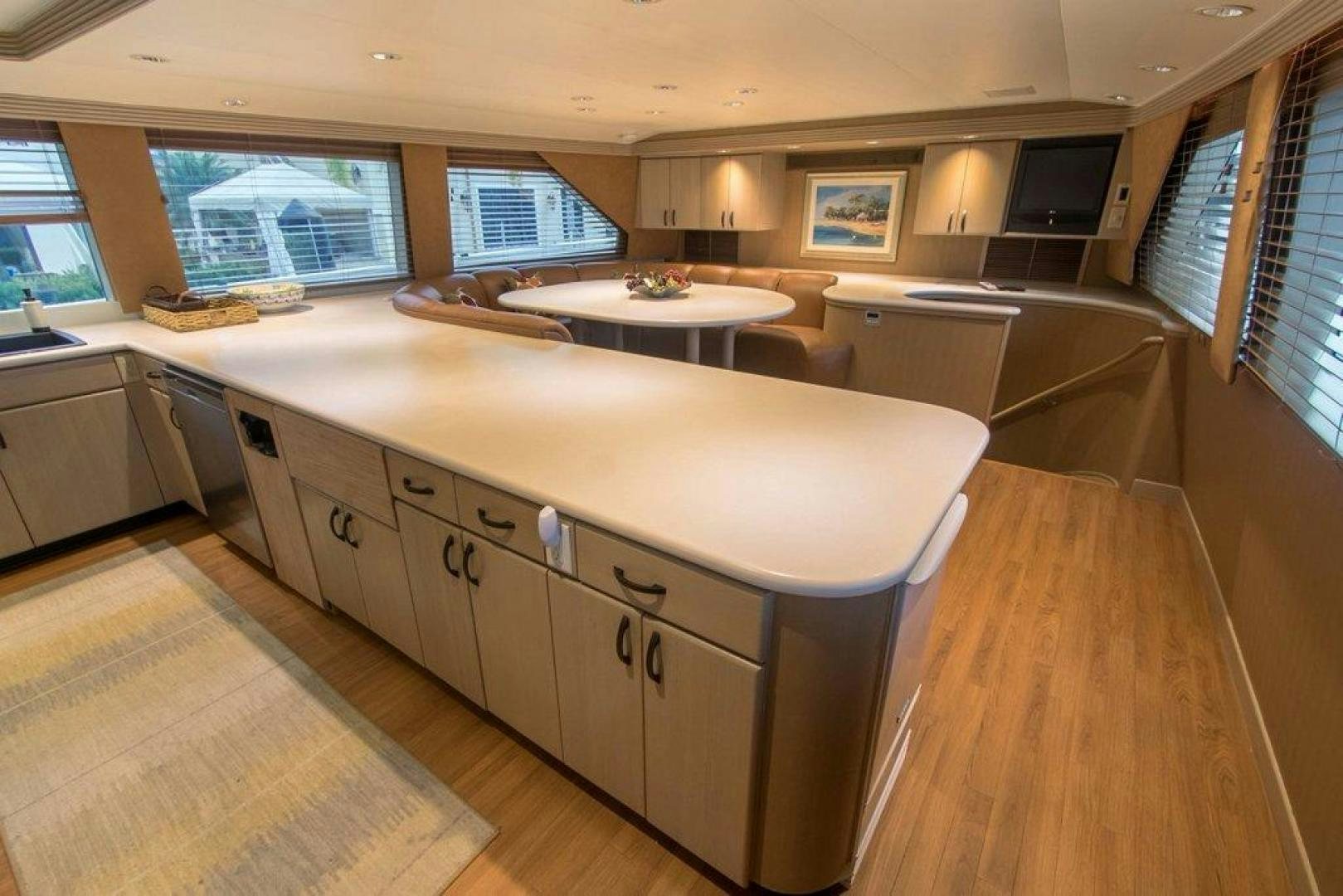 a large kitchen with a large island aboard MONARCH Yacht for Sale