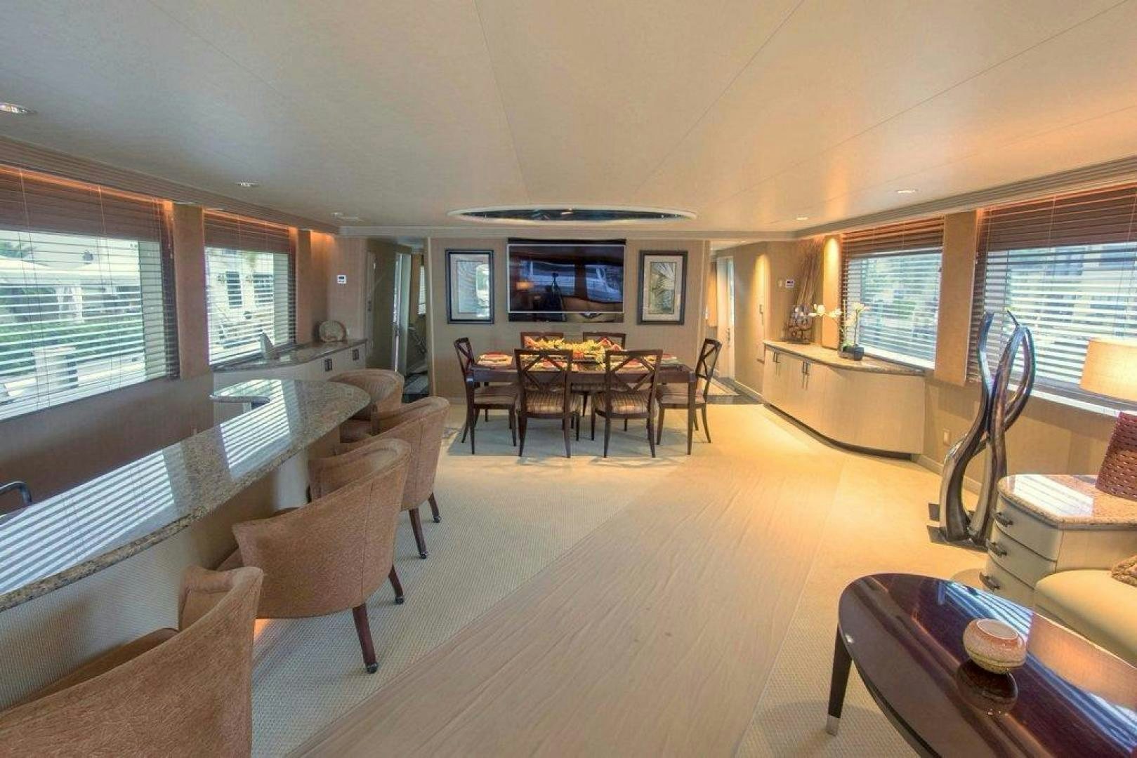 a living room with a large window aboard MONARCH Yacht for Sale