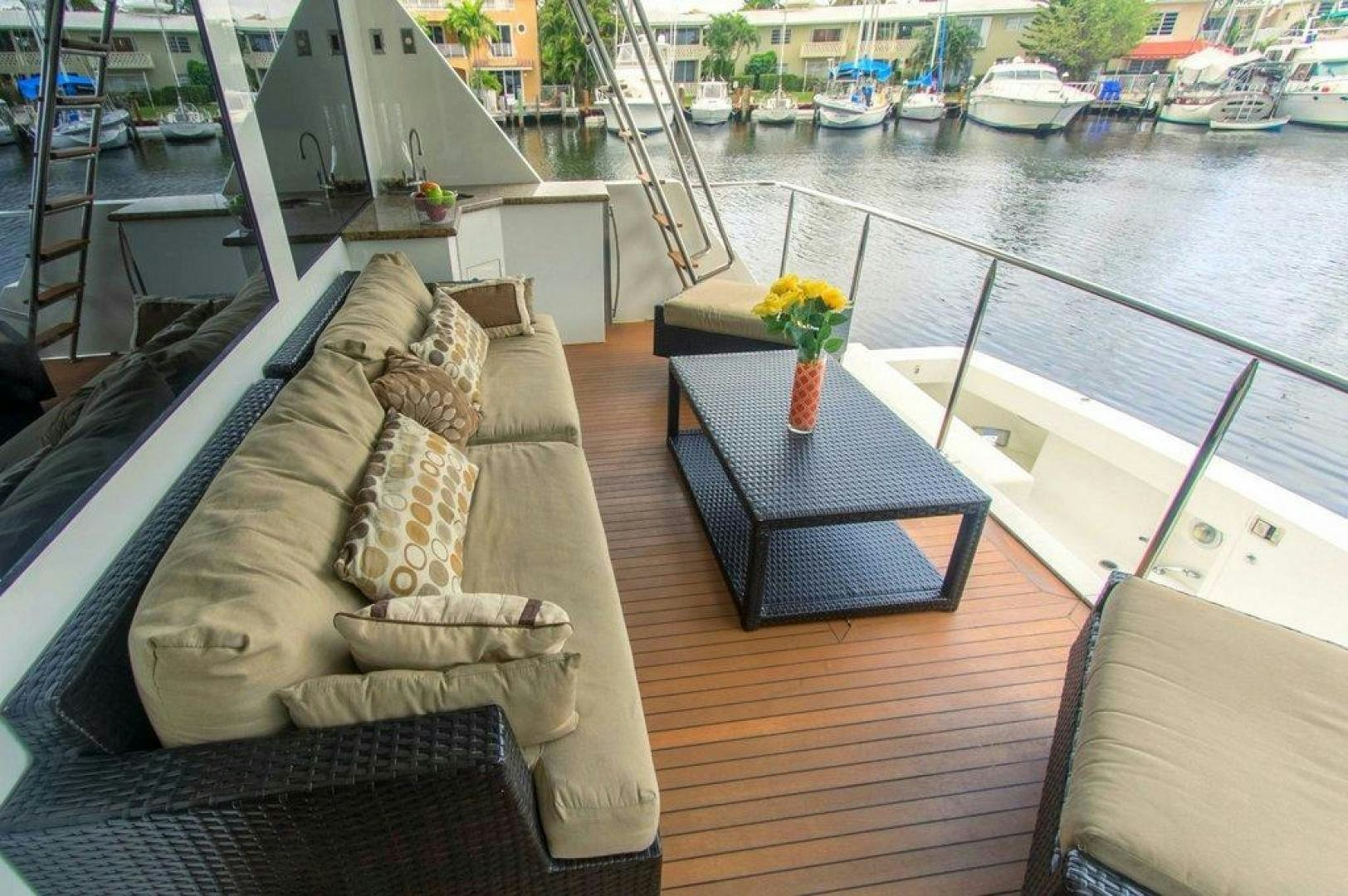 a table on a deck aboard MONARCH Yacht for Sale
