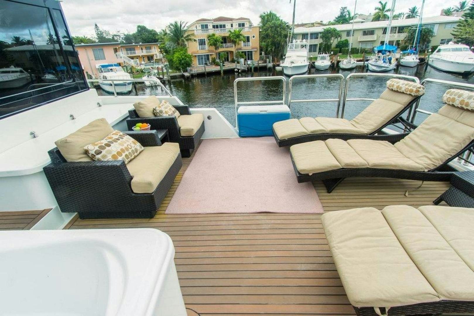 a deck with a pool and boats aboard MONARCH Yacht for Sale