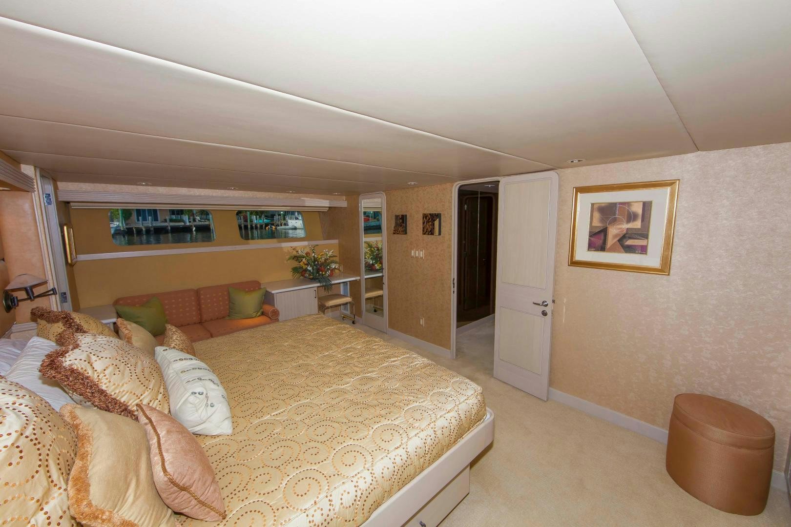 a large bedroom with a bed aboard MONARCH Yacht for Sale