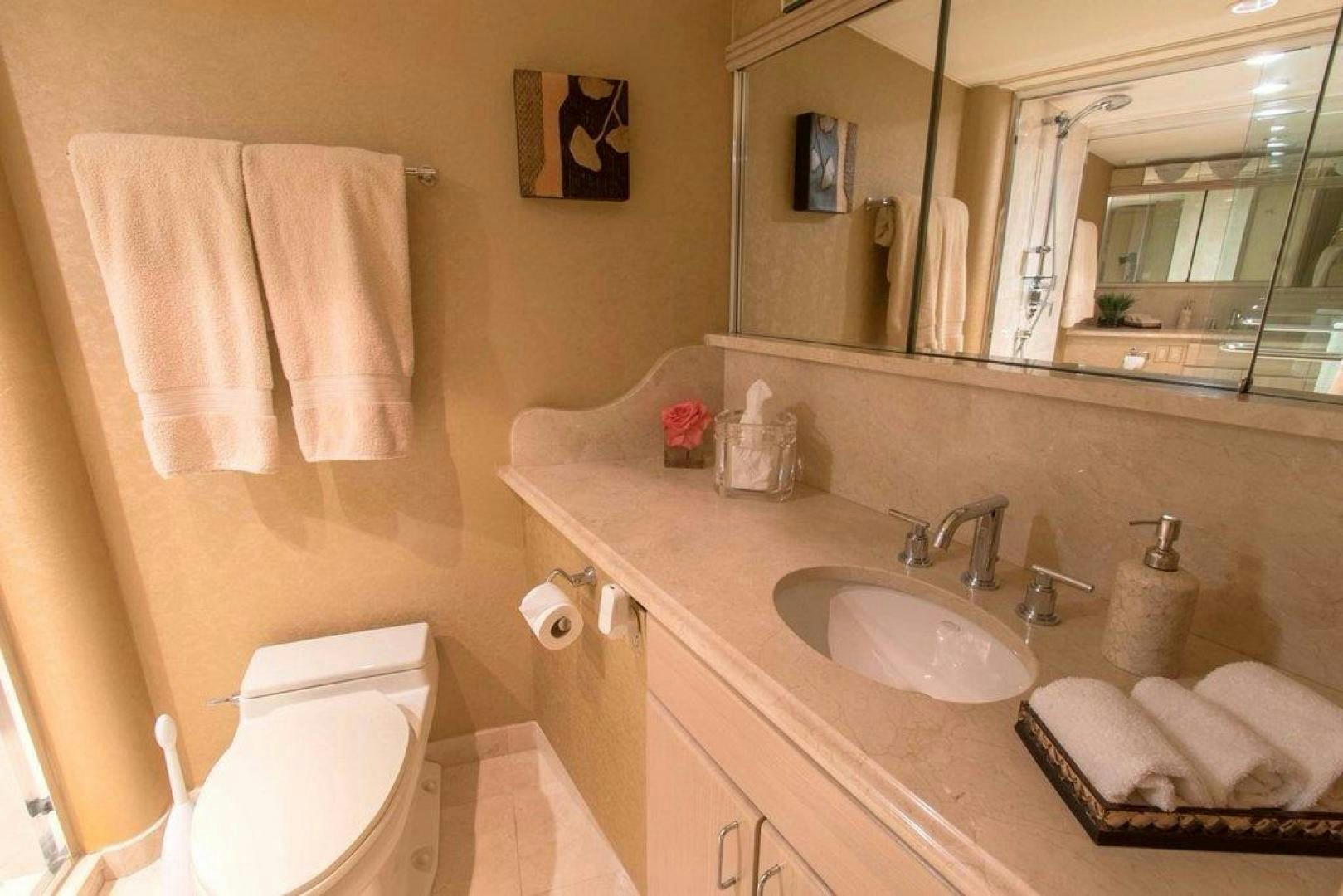 a bathroom with a sink and towels aboard MONARCH Yacht for Sale