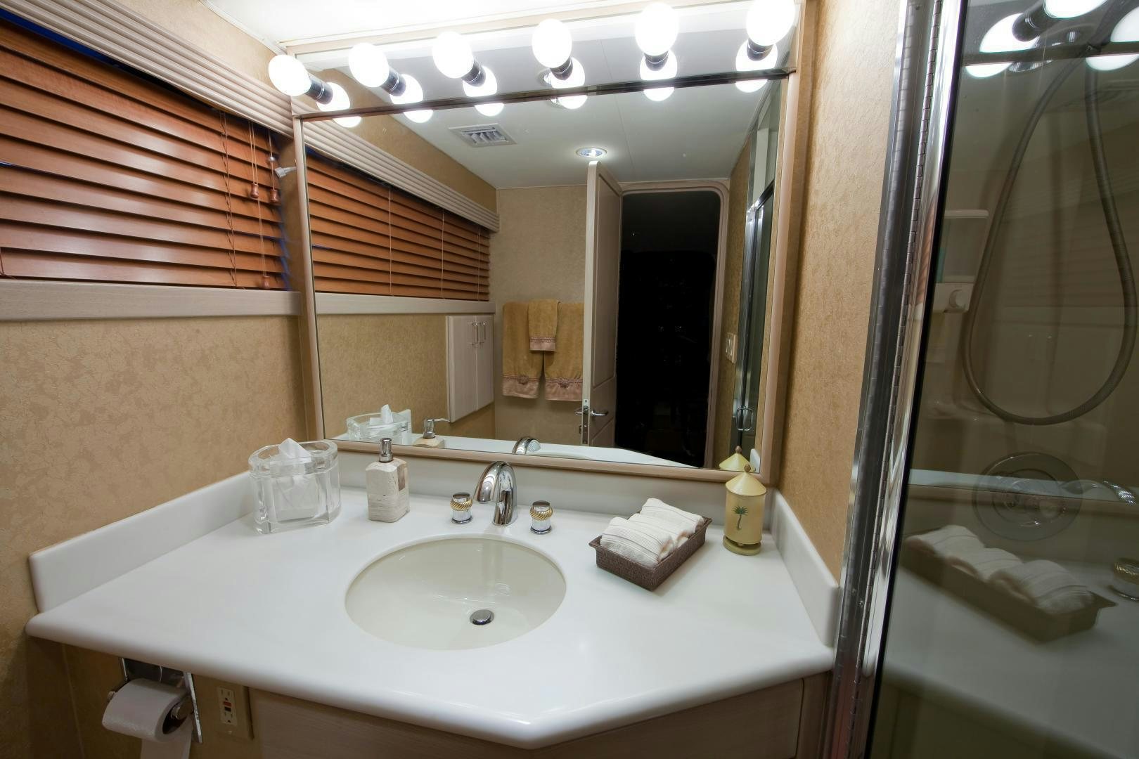 a bathroom with a sink and a mirror aboard MONARCH Yacht for Sale