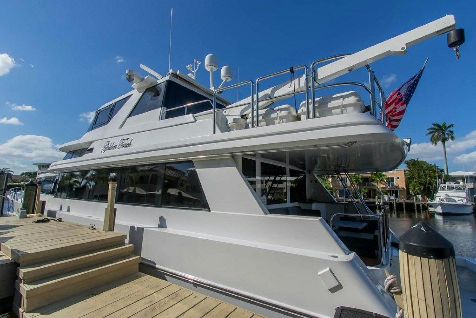 a boat docked at a pier aboard MONARCH Yacht for Sale
