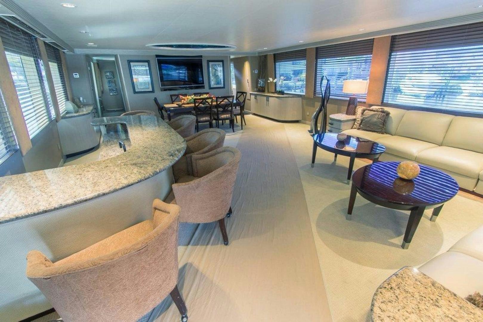 a living room with a large window aboard MONARCH Yacht for Sale