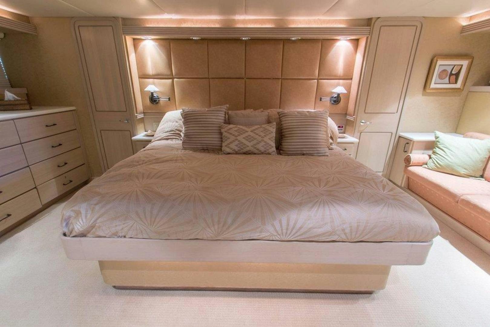 a bed with pillows aboard MONARCH Yacht for Sale