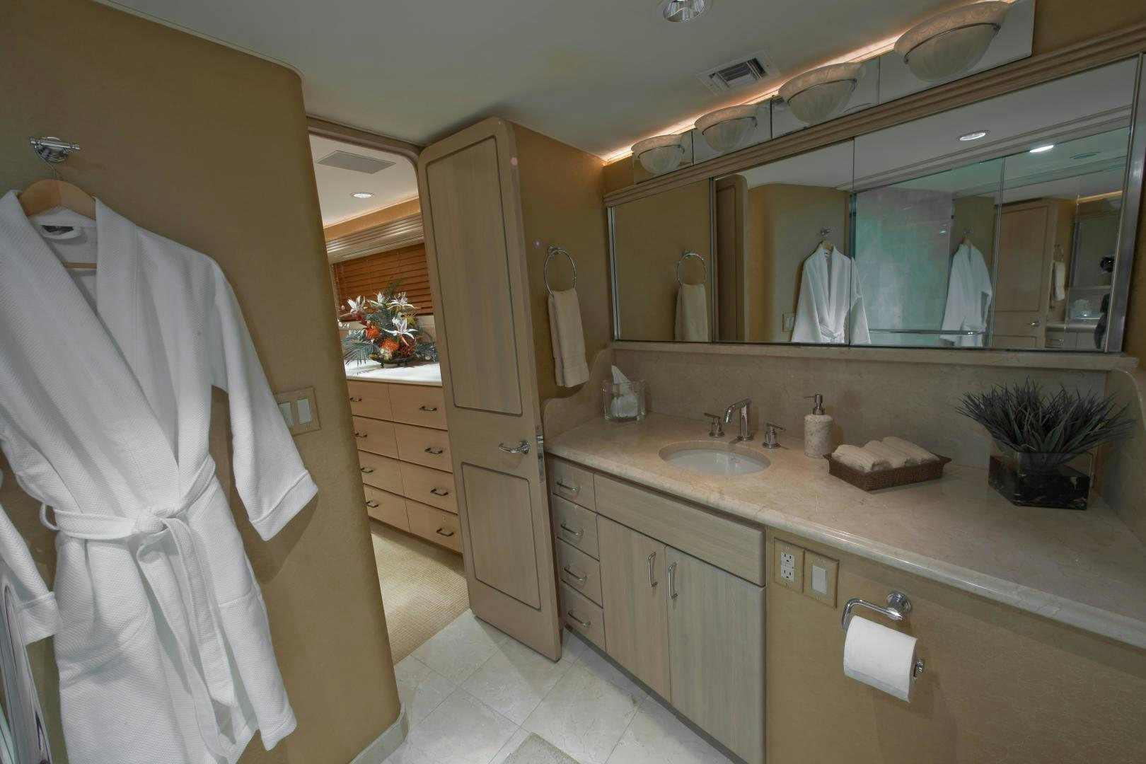 a bathroom with a large mirror aboard MONARCH Yacht for Sale