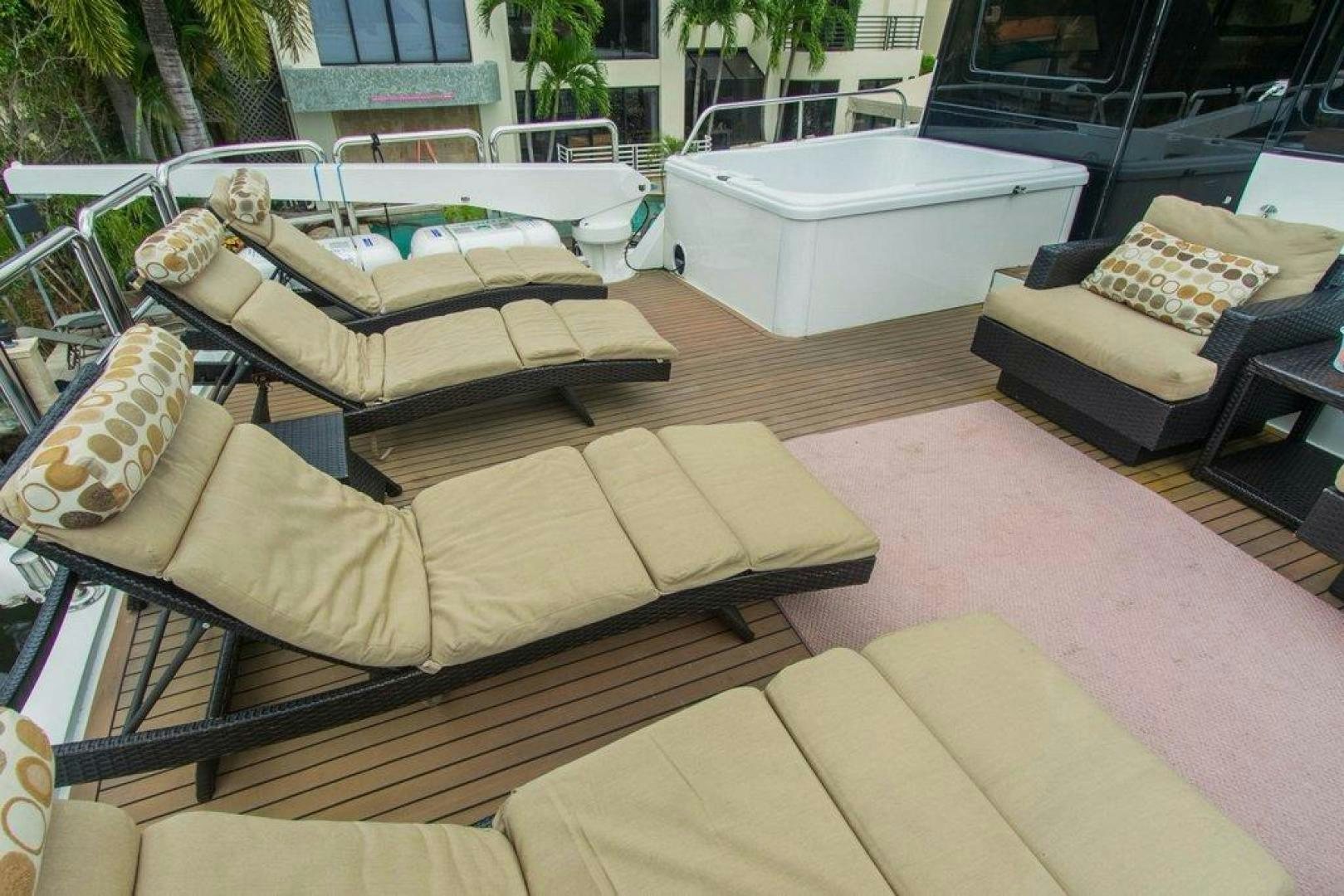 a couch and a table outside aboard MONARCH Yacht for Sale