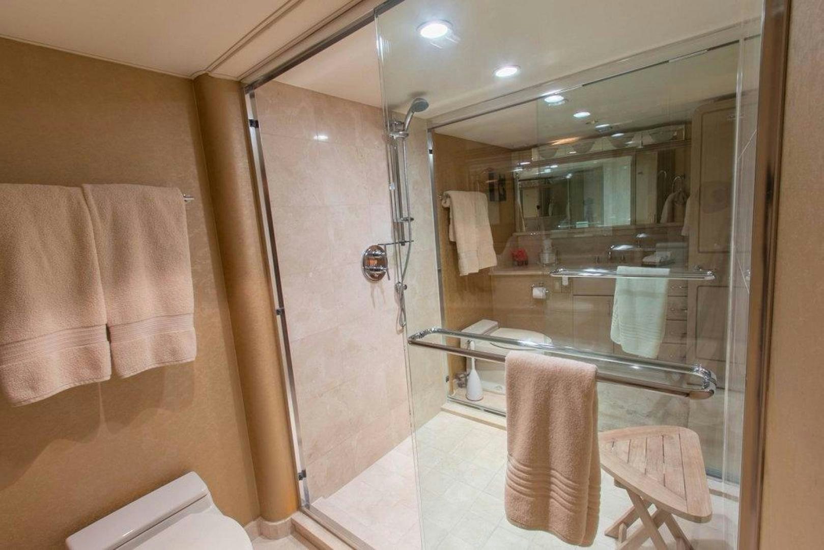 a bathroom with a large mirror aboard MONARCH Yacht for Sale