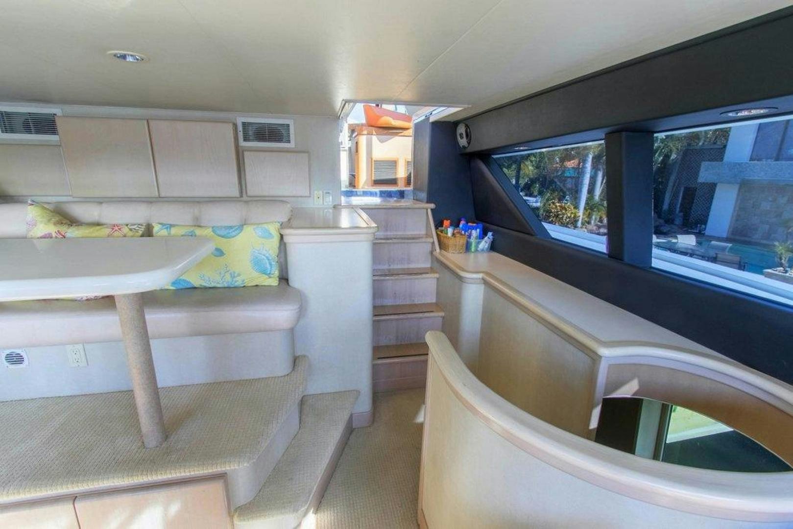 a room with a bed and a table aboard MONARCH Yacht for Sale