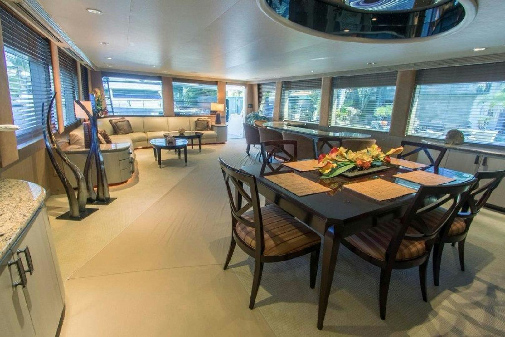 a dining room with a table and chairs aboard MONARCH Yacht for Sale