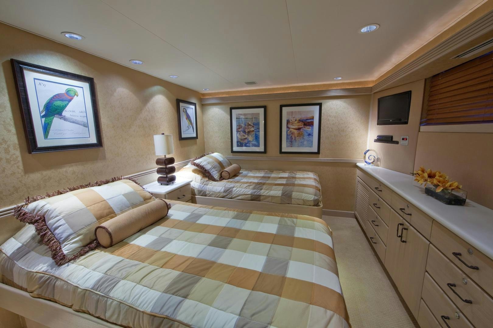 a bedroom with a bed and a couch aboard MONARCH Yacht for Sale