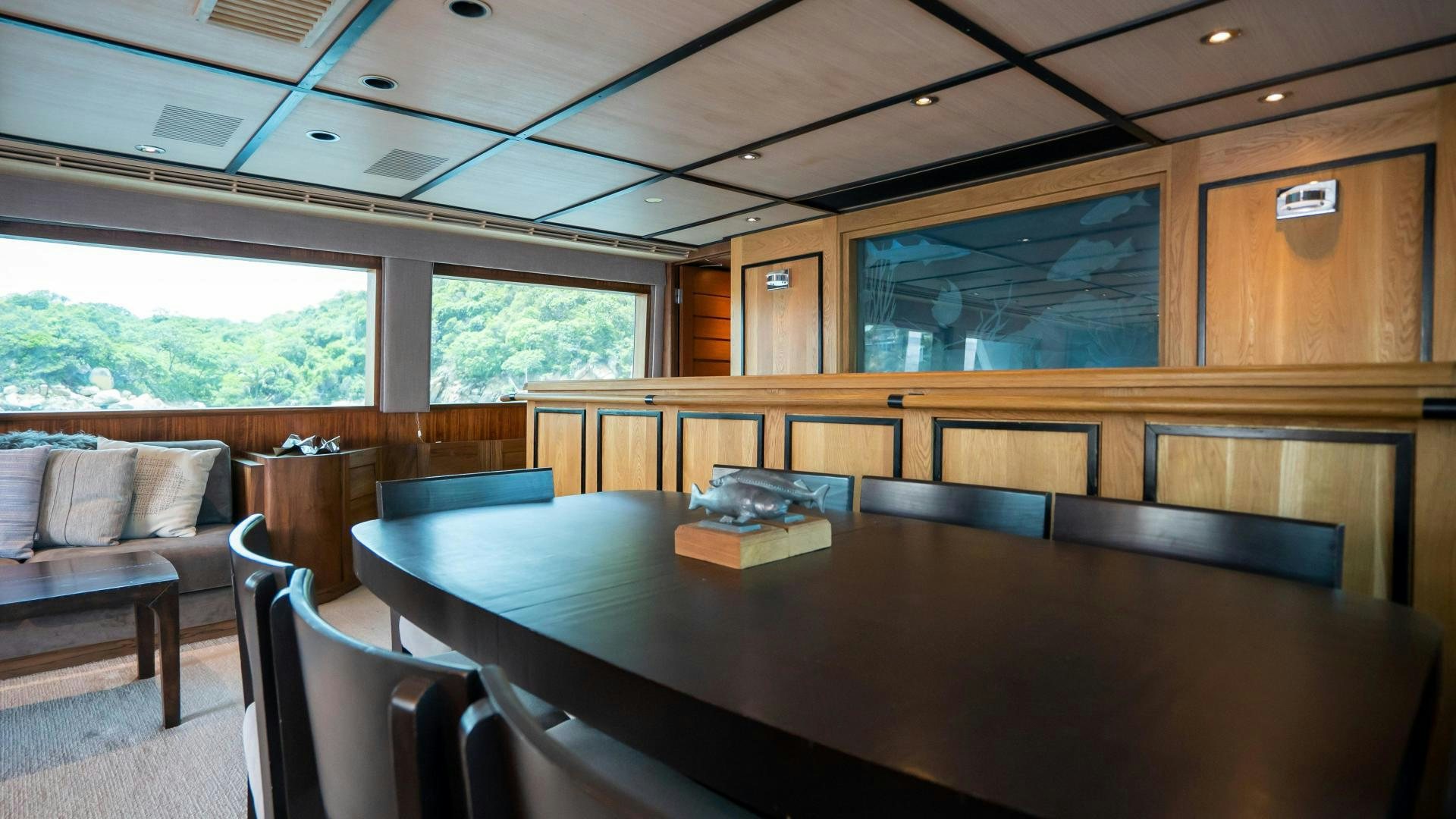 a room with a table and chairs aboard MARAZUL Yacht for Sale