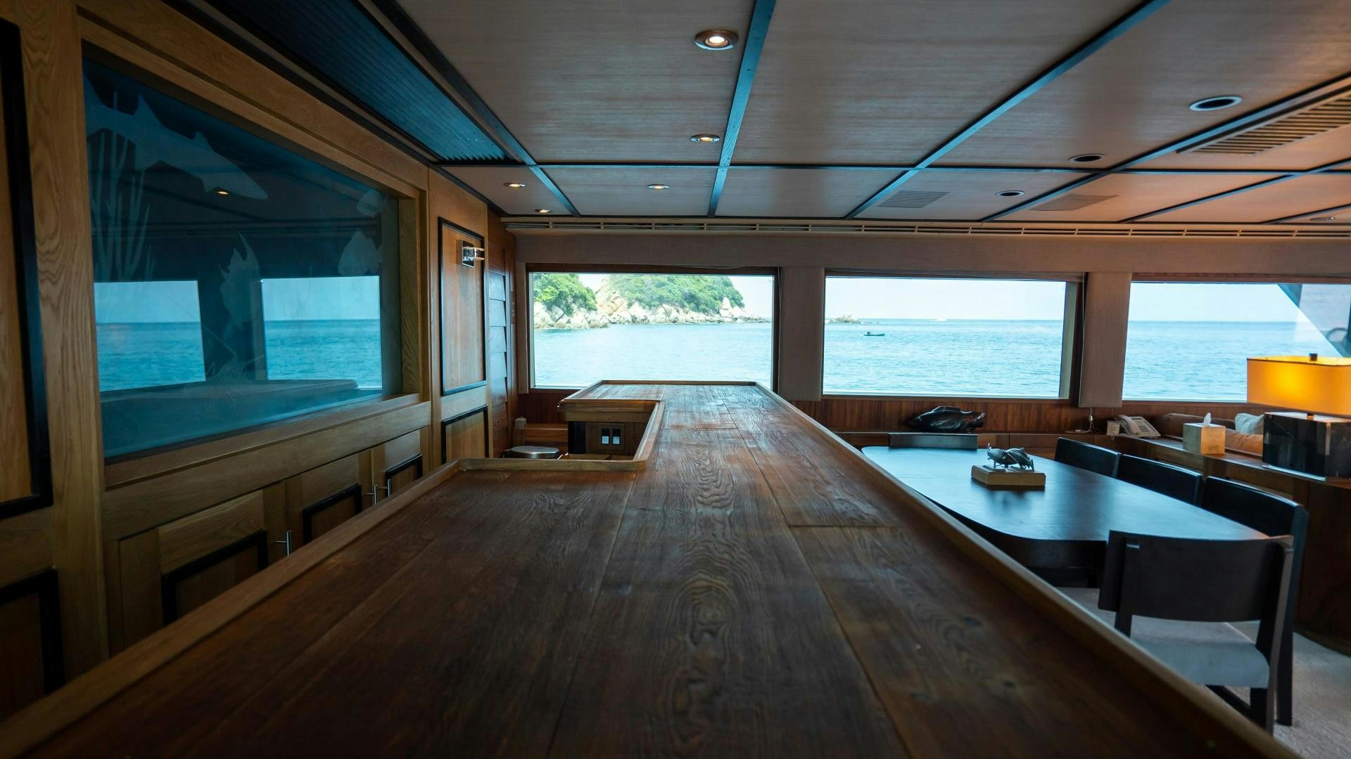 a room with a wood floor and a large window aboard MARAZUL Yacht for Sale