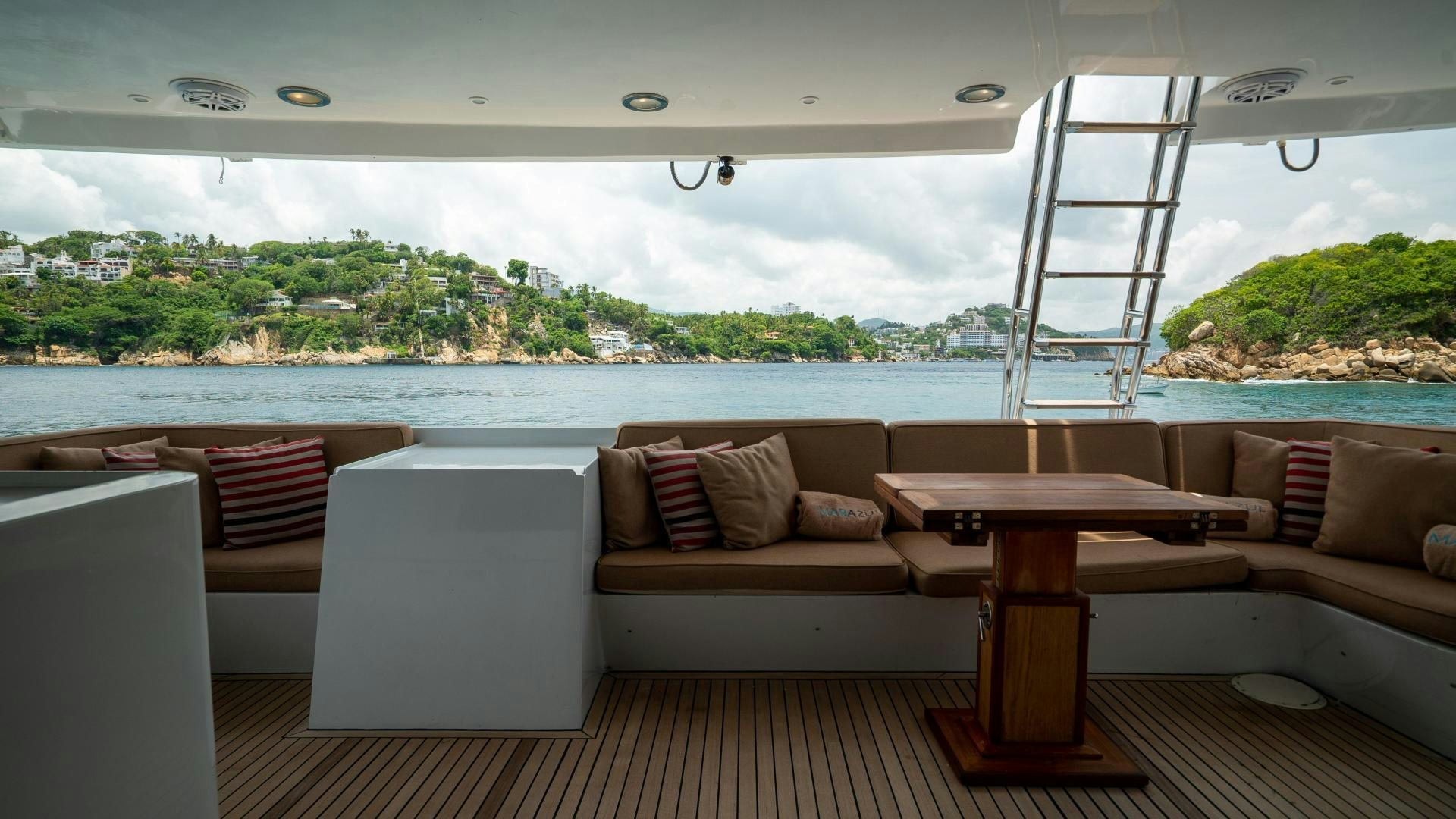 a room with a table and chairs aboard MARAZUL Yacht for Sale