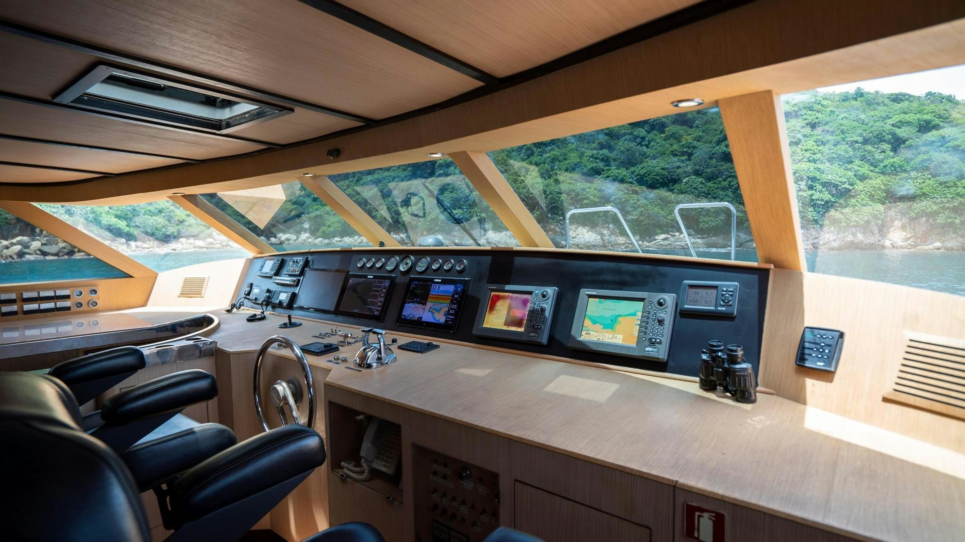 inside of a building with a large window and a view of the city aboard MARAZUL Yacht for Sale