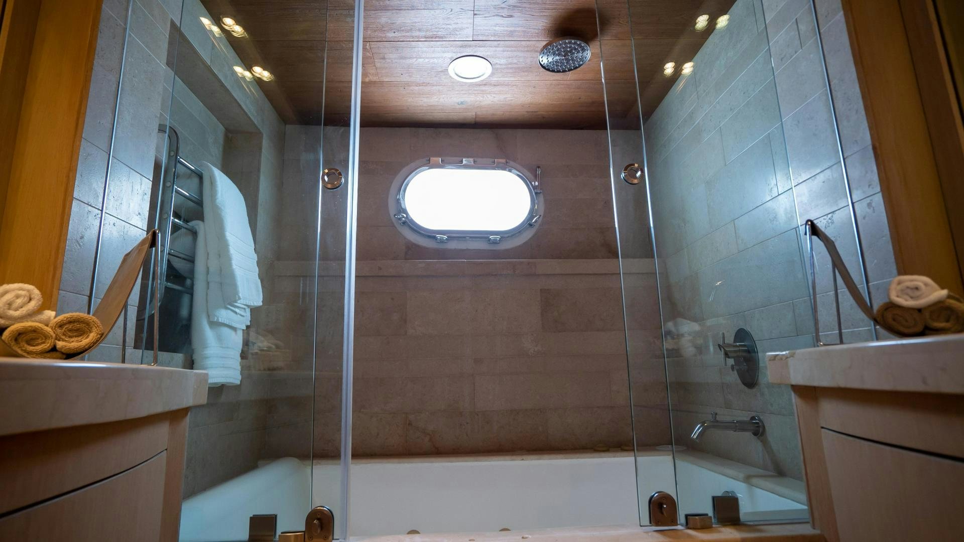 a bathroom with a glass shower aboard MARAZUL Yacht for Sale