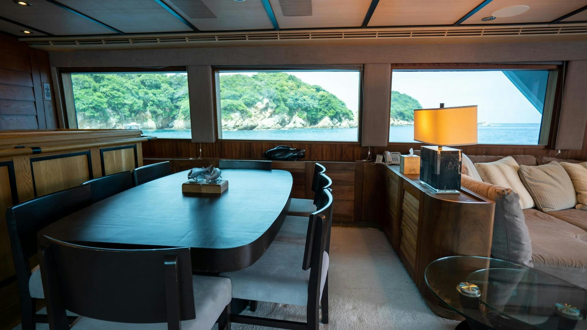 a room with a table and chairs aboard MARAZUL Yacht for Sale