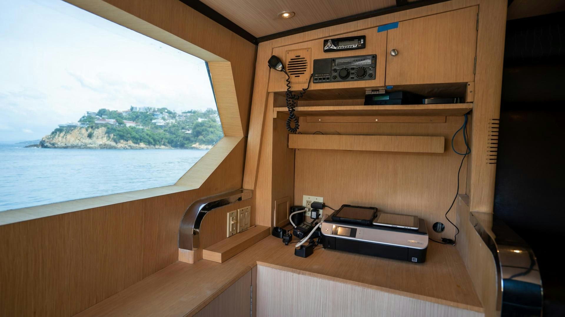 a wooden desk with a printer and a printer on it aboard MARAZUL Yacht for Sale